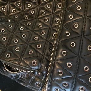Michael kors riveted black backpack. Used in great condition.